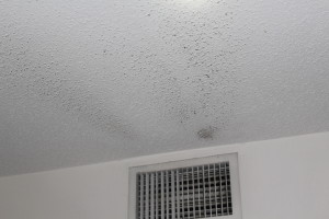 Dust settled o ceiling near AC vent 